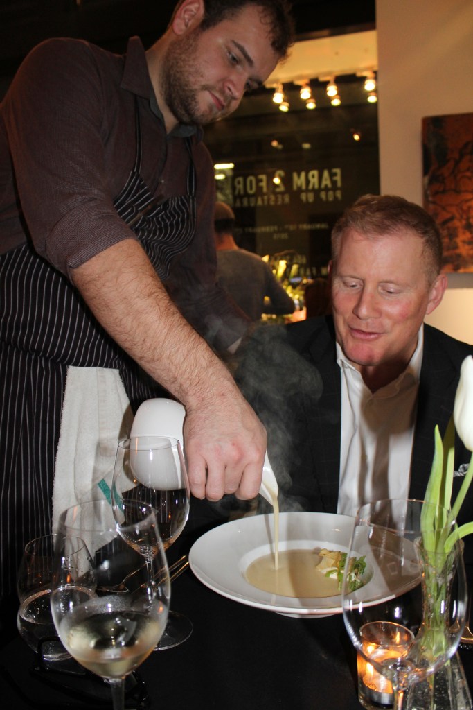 Executive Chef Nicolas Hipperson releasing  the Veloute, for guest Ray Matthews.  Photo Credit: Deanna Beaudoin